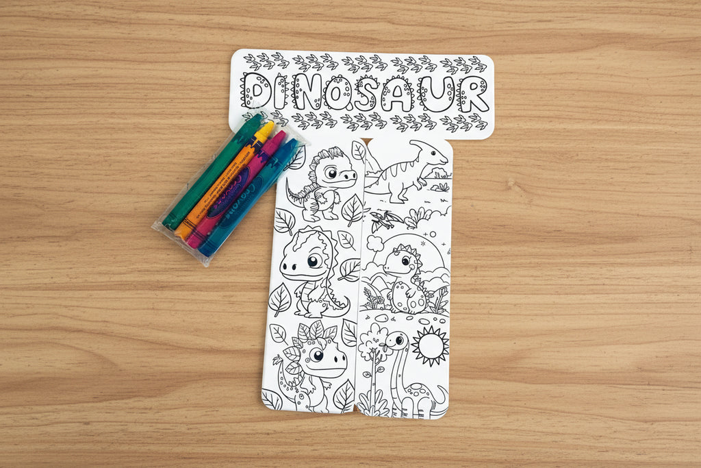 Coloring book with dinosaur illustrations and coloring pencils on a white background