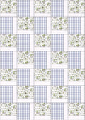 Patchwork pattern with green and white designs on a blue and white checkered background