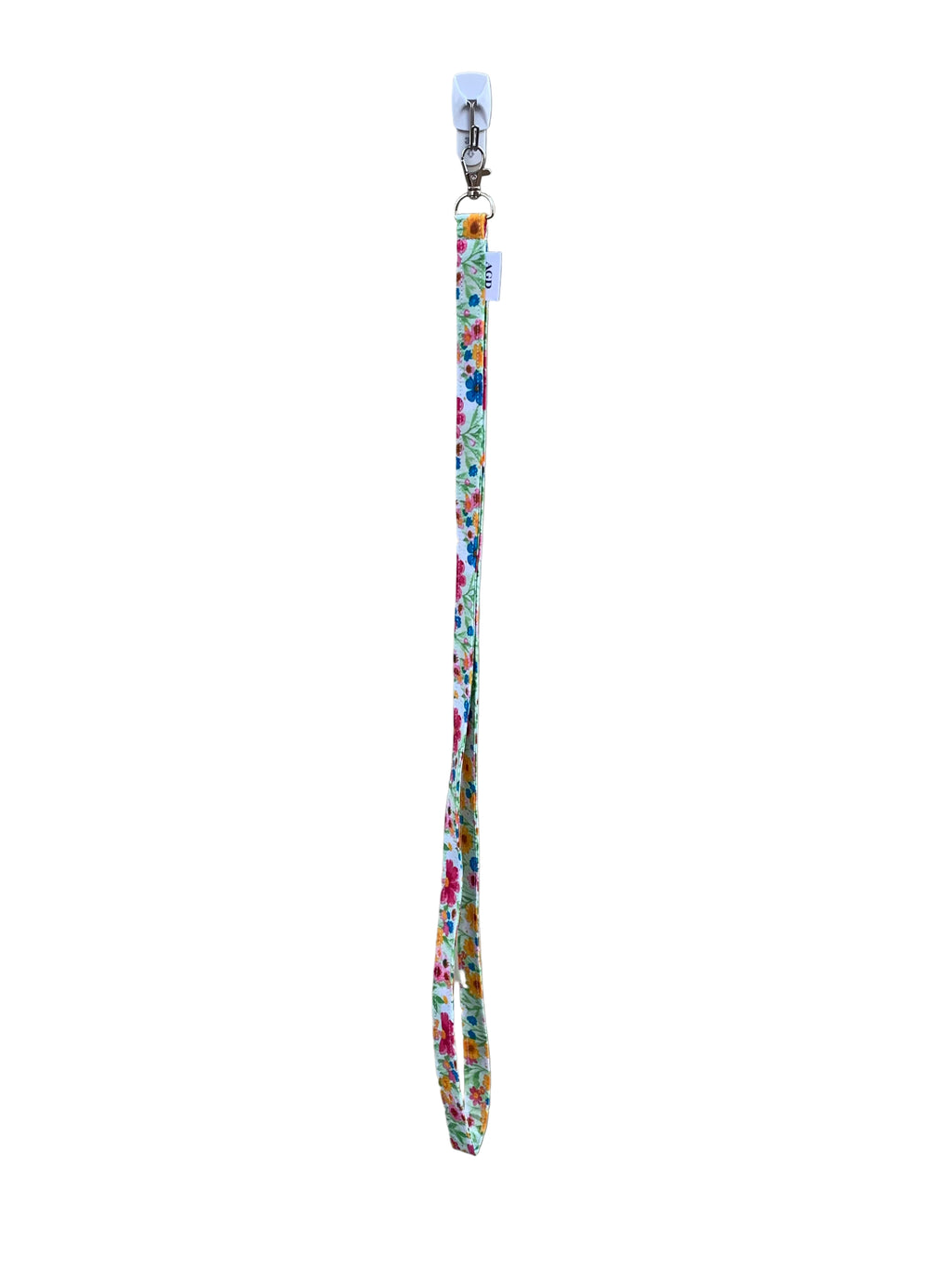 Floral-patterned lanyard on a gray surface