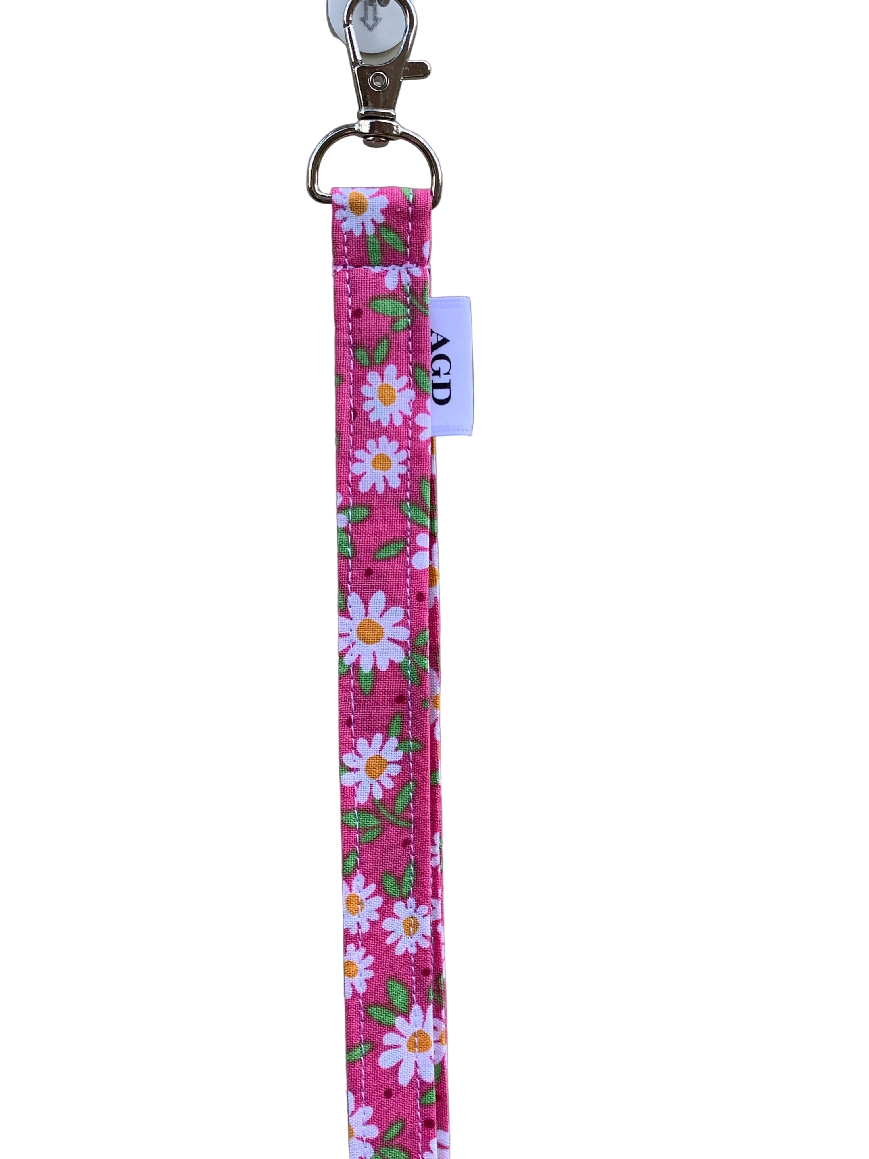 Floral patterned keychain strap on a plain background