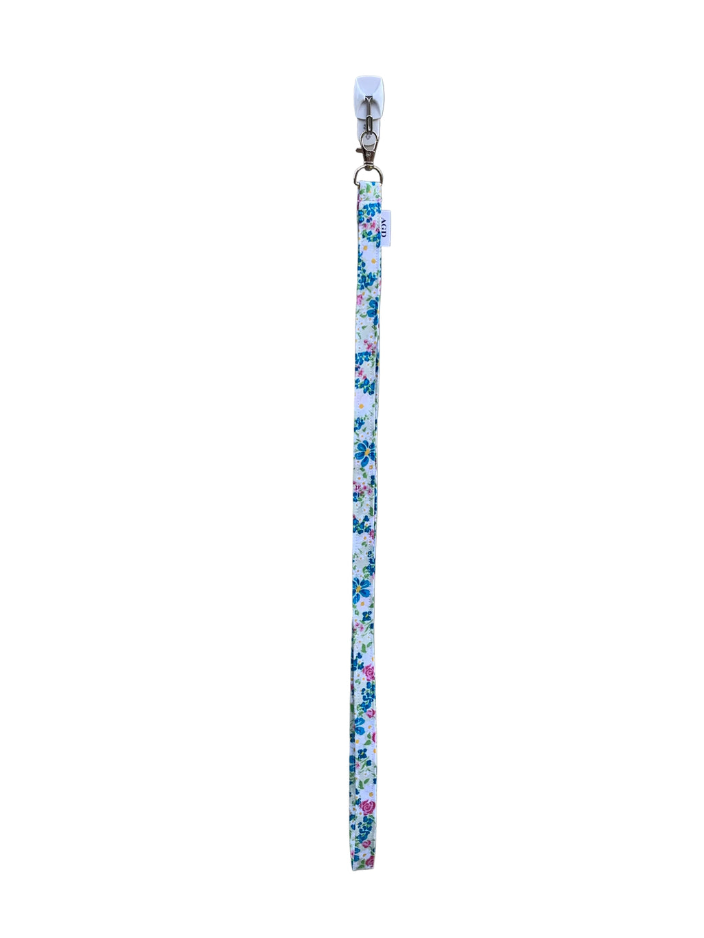 Floral-patterned lanyard on a gray surface