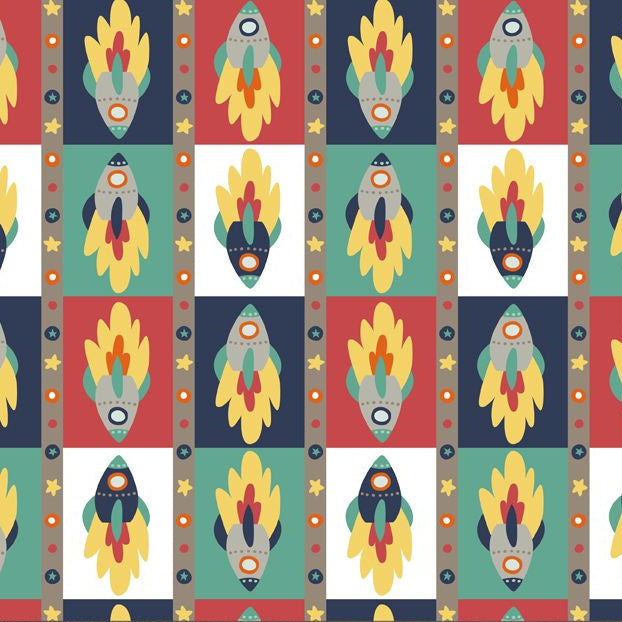 Patterned fabric with rocket ships and a ruler for scale