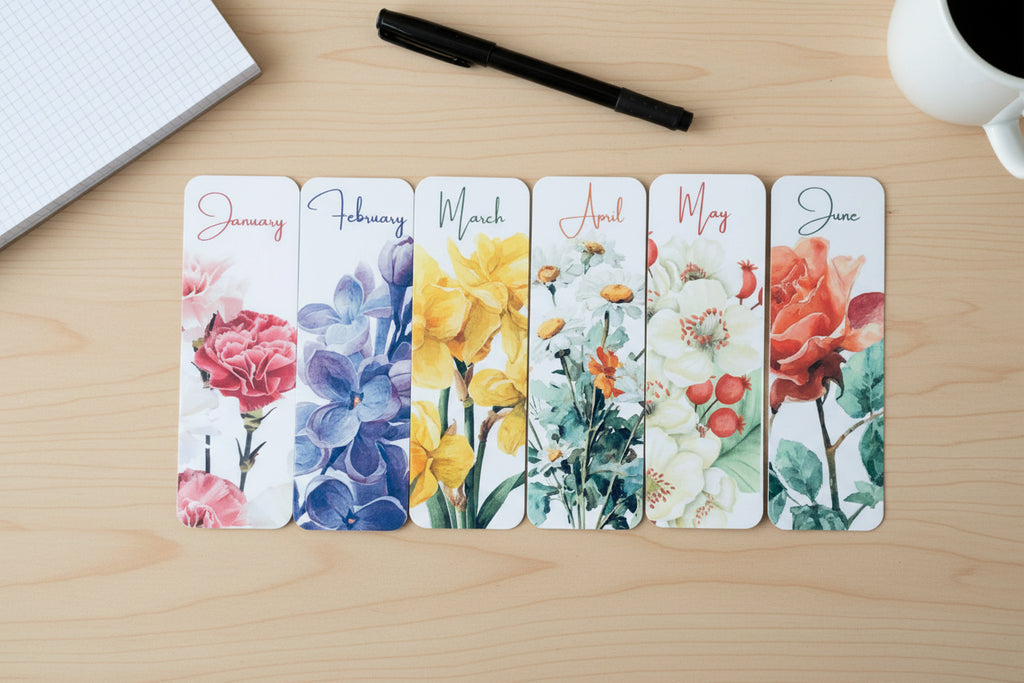 Set of six floral-themed bookmarks with months of the year printed on them.